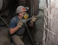 Donetsk, Ukraine - March, 14, 2014: Miner working underground in