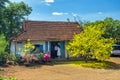 Scenic spring house morning with apricot trees bloom in front of attracting people to wish a happy Lunar New Year