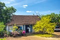 Scenic spring house morning with apricot trees bloom in front of attracting people to wish a happy Lunar New Year