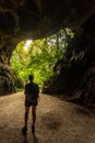 Trung Trung Cave Cat Ba Vietnam Girl Tourist standing at the entrance Royalty Free Stock Photo