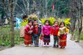 VAN, HA GIANG, VIETNAM, December 18th, 2017: Unidentified ethnic minority kids with baskets of rapeseed flower in Hagiang Royalty Free Stock Photo