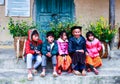 VAN, HA GIANG, VIETNAM, November 18th, 2017: Unidentified ethnic minority kids with baskets of rapeseed flower in Hagiang. Royalty Free Stock Photo