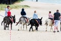 Donkey ride enjoyed by children on beach