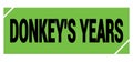 DONKEY`S YEARS text on green-black grungy stamp sign Royalty Free Stock Photo