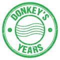 DONKEY`S YEARS text on green round postal stamp sign Royalty Free Stock Photo