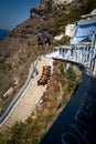 the donkeys bring the tourists up the mountain on the island of Santorini