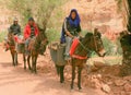 Three men riding on donkeys Royalty Free Stock Photo