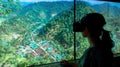 Donor wearing virtual reality headset exploring immersive 360degree tour of community development project highlighting Royalty Free Stock Photo