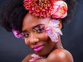 Dont be afraid to experiment with your look. Studio shot of a beautiful young woman posing with flowers in her hair. Royalty Free Stock Photo