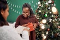 Dont forget to appreciate the greatest gift ever...friendship. Shot of two happy young women exchanging gifts during Royalty Free Stock Photo