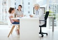 Dont forget your annual checkup. a mature female doctor talking to a patient at a hospital. Royalty Free Stock Photo