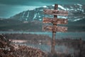 Dont give up text quote engraved on wooden signpost outdoors in landscape looking polluted Royalty Free Stock Photo