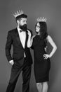 Dont go to prom alone. Prom king and queen. Sensual woman and bearded man wear prom crowns. Coronation party. Holiday