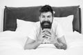 Dont hurry drink coffee. Happy hipster drink coffee in bed. Bearded man enjoy hot drink. Breakfast drink. Good coffee