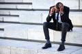 Dont let bad news ruin your day. a young businessman using a phone in the city. Royalty Free Stock Photo