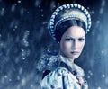 Dont let her gaze fall upon you. Portrait of a evil-looking queen with snow falling around her. Royalty Free Stock Photo