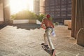 Dont look back, youre not going that way. Shot of a young man skating in the city.