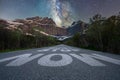 Dont stop now text quote printed on asphalt road towards the mountains and the milky way