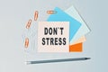 DonT Stress - text on sticky note paper on gray background. Closeup of a personal agenda. Top view Royalty Free Stock Photo