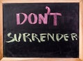 Dont surrender word on blackboard