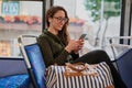 Dont text and drive. Take the bus. High angle shot of an attractive young woman listening to music while sitting on a Royalty Free Stock Photo