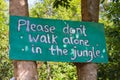 Dont walk alone in the jungle sign board on the tr