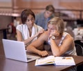 Dont worry, youve got this. Two students researching their assignments together on a laptop.