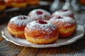 Donut berliner on white plate, Sufgania with powdered shugar and jam