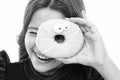 Donut breaking diet concept. Girl hold glazed donut white background. Kid girl hungry for sweet donut. Sugar levels and