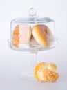 Donut, bun, cookie & glass jar on background Royalty Free Stock Photo