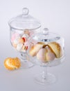 Donut, bun, cookie & glass jar on background Royalty Free Stock Photo