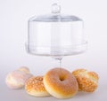 Donut, bun, cookie & glass jar on background Royalty Free Stock Photo