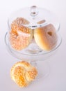 Donut, bun, cookie & glass jar on background Royalty Free Stock Photo