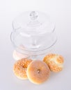 Donut, bun, cookie & glass jar on background Royalty Free Stock Photo