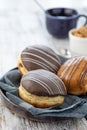 Donut or bun made from sweet yeast dough stuffed with chocolate and icing.