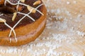 Donut chocolate glazing on wooden background. Royalty Free Stock Photo