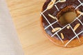 Donut chocolate glazing on wooden background, Assorted Colorful.