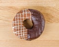 Donut chocolate glazing on wooden background, Assorted Colorful.