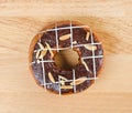 Donut chocolate glazing on wooden background, Assorted Colorful. Royalty Free Stock Photo