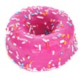 Donut coated with a pink frosting and sprinkles of different col Royalty Free Stock Photo