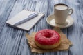 Donut, cup of coffee and notebook Royalty Free Stock Photo