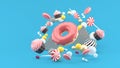 Donut ,Cupcakes ,Macaron,Candy floating among colorful balls on a blue background. Royalty Free Stock Photo