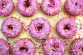 Donut donuts sprinkles on doughnuts pink bright yellow sugar strands background