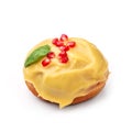 Donut glazed with honey and pomegranate. View from a forty-five degree angle. Isolated image