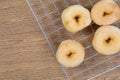 Donut on grille isolated on wood table Royalty Free Stock Photo