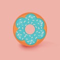 Donut isolated on light orange background. Cute, colorful and glossy doughnut with blue turquoise glaze and white powder Royalty Free Stock Photo
