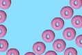 Donut pattern lay flat on top view blue background. Royalty Free Stock Photo