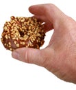 A donut in a persons hand Royalty Free Stock Photo