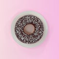 Donut on a plate on a pink background
