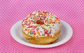 Donut with sprinkles on a plate